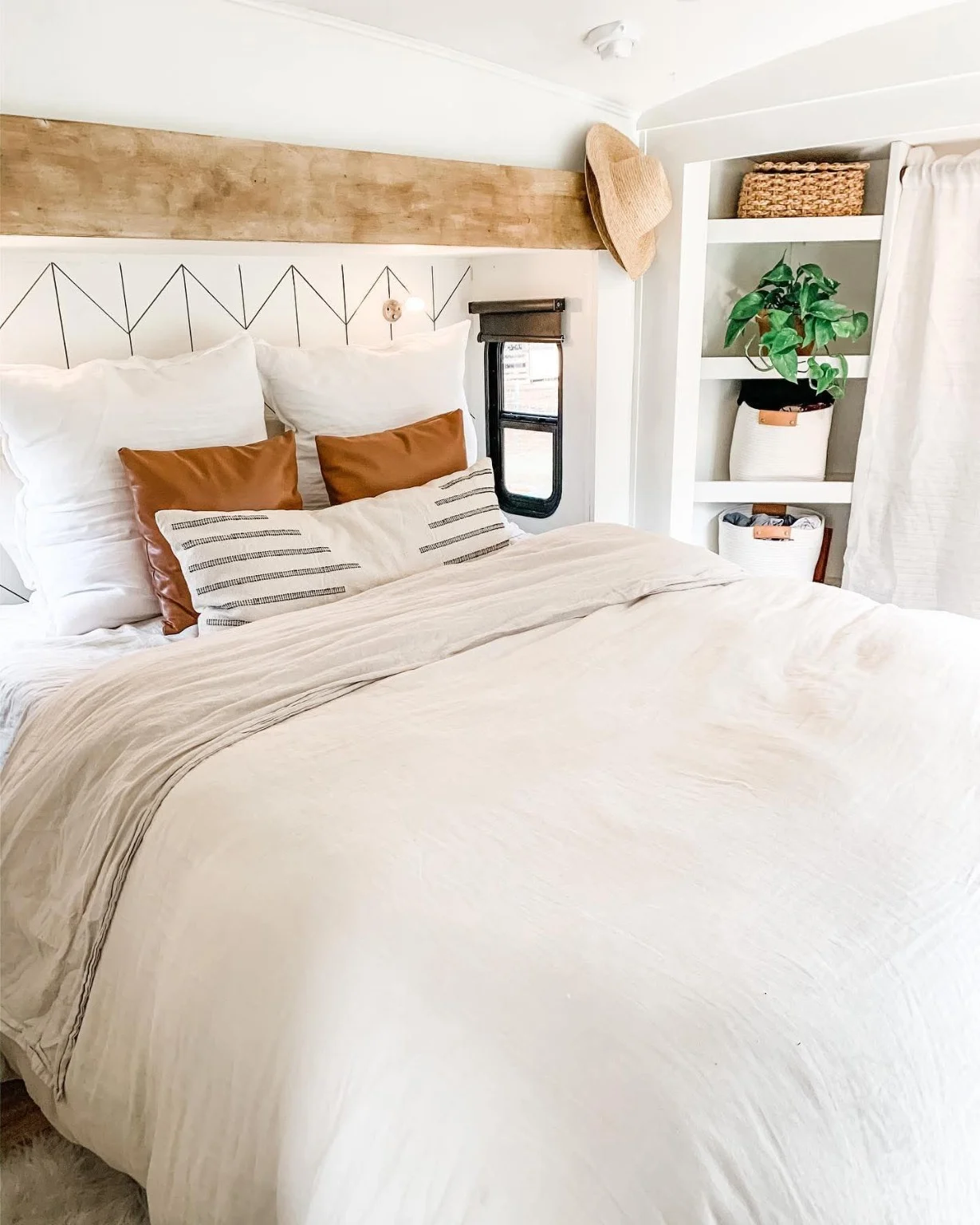 Bright customer bedroom with warm wood accents